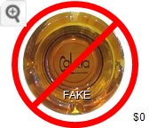 Fake - Produced by an unscrupulous eBay seller (c. 2008). - Red and brown on white imprint Glass Ashtray