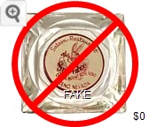 Snowshoe Lodge; A 'reproduction' ashtray made by applying a vinyl decal to the bottom of an old ashtray, then painted over. (2018) - Red on white decal imprint Glass Ashtray